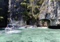 Boats with tourists near entrance to a Monkey island near a tropical Koh Hong island