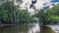 Boats with tourists sail along a tropical river in the rain forest. Royalty Free Stock Photo