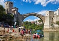 Boats and Tourists underneath Stari Most in Mostar Royalty Free Stock Photo