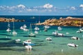 Boats and transparent water on Coz-Pors beach in Tregastel, CÃÂ´tes d`Armor, Brittany France Royalty Free Stock Photo