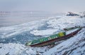 Boats trapped on the bank of the frozen river Danube
