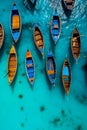 Boats in the turquoise water of the Indian Ocean, Sri Lanka. Top view of traditional Thai boats in the sea.