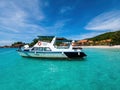 Boats, turquoise water and white sand beach, Redang Island, Malaysia