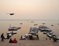 The boats of Varanasi with bird flying overhead