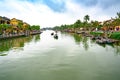 Boats on canal in tourist destination Hoi An, Vietnamese women in Hoi An, Vietnam