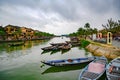 Boats with lampions on canal in tourist destination Hoi An, Vietnamese women in Hoi An, Vietnam