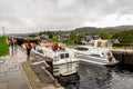 Boats waiting for locks to be opened to enter the Caledonian Canal from Loch Ness in Fort Augustus, Scotland