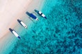 Boats on the water surface from top view. Azure water background from top view. Summer seascape from air.