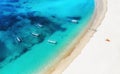 Boats on the water surface from top view. Turquoise water background from top view. Summer seascape from air. Bali island, Indones Royalty Free Stock Photo