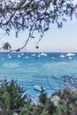 Boats and yachts anchored close to the sea shore in blue lagoon Royalty Free Stock Photo