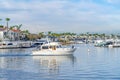 Boats and yachts on calm sea bordered by houses in Huntington Beach California Royalty Free Stock Photo