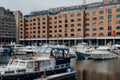 Boats and yachts moored in St Katharine Docks in Central London, UK