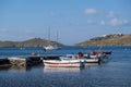 Boats and yachts are moored at a stone quay at Vourkari Tzia, Kea island, Greece