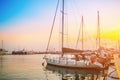 Boats and yachts in sea marina in old Limassol port at sunset, harbor in mediterranean coast, Limassol, Cyprus