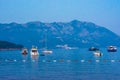 Boats and yachts stand in the sea against the backdrop of the mountains Royalty Free Stock Photo