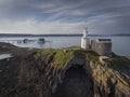 Mumbles Lighthouse, pier and Bob`s cave Royalty Free Stock Photo