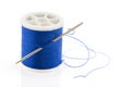 Bobbin with blue thread Royalty Free Stock Photo