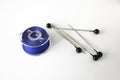 Bobbin with blue thread and pins. Royalty Free Stock Photo