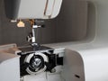 Bobbin case is in the machine designed to use front loading bobbins. Concept of threading the sewing machine Royalty Free Stock Photo