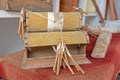 bobbin lace. Close-up of an antique machine dedicated to the beautiful art of weaving yarns