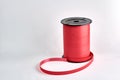 Bobbine red ribbon on white background with copyspace Royalty Free Stock Photo