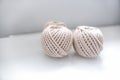 Bobbins of light beige pastel color together for weaving macrame needlework Royalty Free Stock Photo