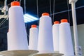 Bobbins with white threads secured in an industrial sewing machine Royalty Free Stock Photo