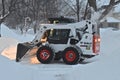 Bobcat doing snow removal Royalty Free Stock Photo
