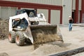 Bobcat Dumping Sand