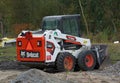 Bobcat S550 skid-steer loader parked on construction site Royalty Free Stock Photo