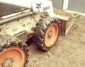 Bobcat skid loader equipment digging in dirt Royalty Free Stock Photo