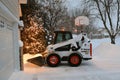 Bobcat skid steer removing snow