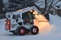 Bobcat skid steer removing snow