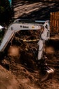 Bobcat Tractor Digging up Earth to build Houses Royalty Free Stock Photo