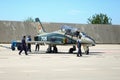 Mechanics attend IAR 99 Soim (Hawk) advanced trainer and light attack airplane, used as jet trainer of the Romanian Air Force Royalty Free Stock Photo