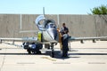 Mechanics attend IAR 99 Soim (Hawk) advanced trainer and light attack airplane, used as jet trainer of the Romanian Air Force Royalty Free Stock Photo