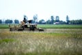 Romanian soldiers man a Humvee armored vehicle on a field, on a sunny summer day during a drill Royalty Free Stock Photo