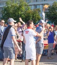 Bobruisk Belarus 06 03 2019: A man carries a torch with the Olympic flame at the European Games in 2019