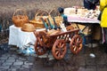 BOBRUISK, BELARUS 10.03.2019: Sale of wood products handmade. Wooden wagon with wicker baskets on it, traditional Royalty Free Stock Photo