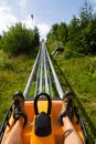 Bobsled Roller Coaster Toboggan in summer day, Rittisberg, Austrian Alps