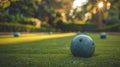 A bocce ball making the critical hit, with the other balls and the pallino in a strategic blur in the background Royalty Free Stock Photo