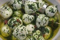 Bocconcini with olive oil and pesto Royalty Free Stock Photo