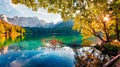 On the boder with Slovenia located two fantastic lake - Fusine Superiaore and Fusine Inferiore. Bright morning scene of Julian Alp Royalty Free Stock Photo