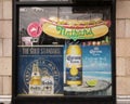 A bodga window with ads for food and beverages Royalty Free Stock Photo