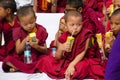 Bodh gaya bihar india on april 29th 2018: Young Buddhist monks enjoying mango juice in the buddha purnima event at Bodhgaya bihar