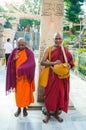 BODHIGAYA, INDIA - MAY 13, 2014: Unknow monks stand for charity