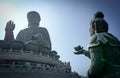 A Bodhisattva makes an offering to the Great Buddha at Lan tau island, Hong-Kong.