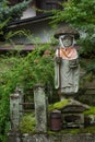 Bodhisattva statue in garden of Hikakokubun-ji Buddhist Temple.