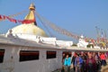 BODHNATH, NEPAL - DECEMBER 23, 2014: Tibetan pilgrims walking around the Bodhnath Stupa near Kathmandu Royalty Free Stock Photo