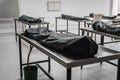 Covered human corpses on tables in a morgue / mortuary waiting for identification, autopsy, burial or cremation. Taken in Armenia